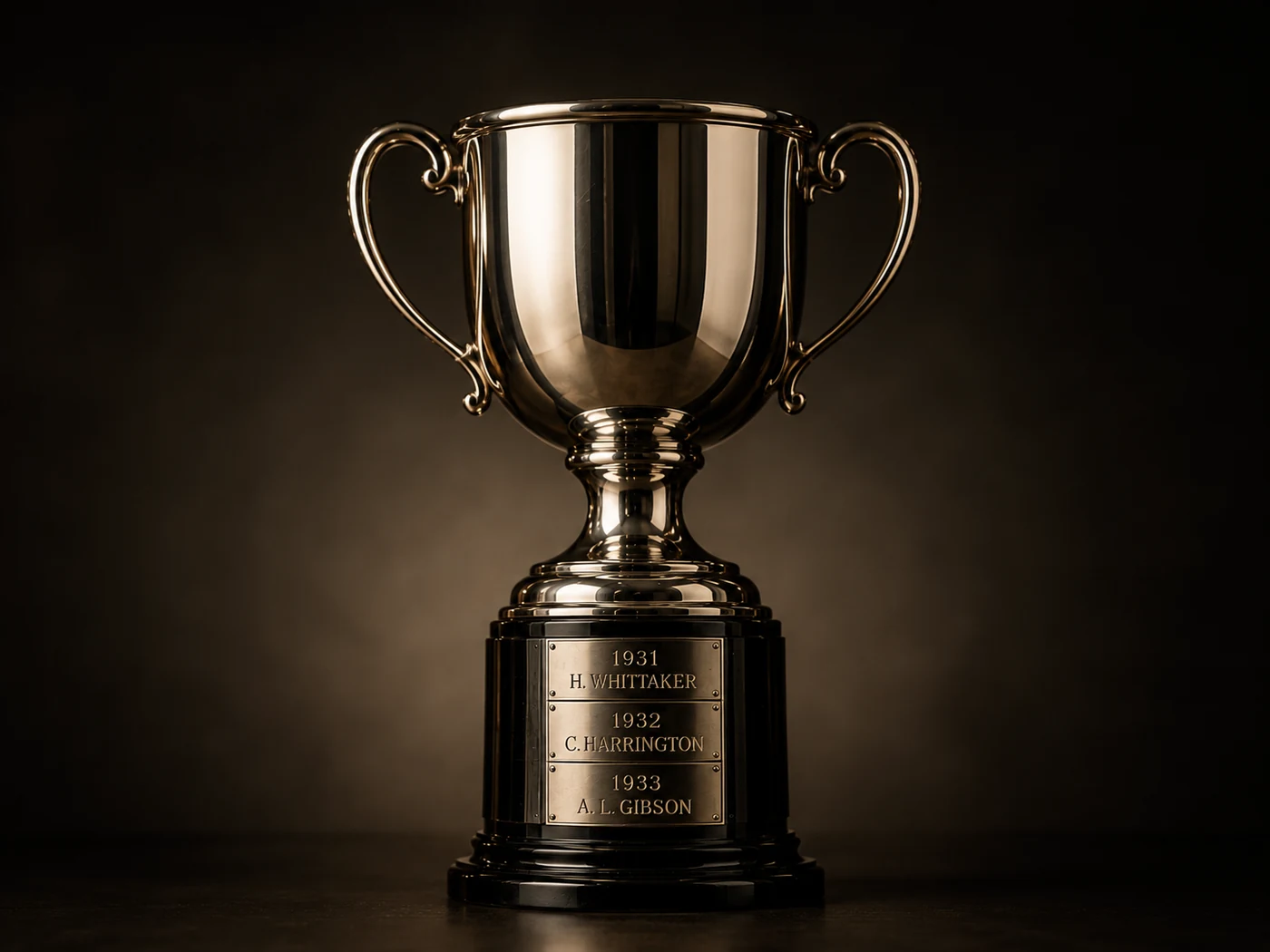 Historic silver cup being catalogued from its engraved winners